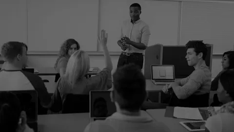 Small class of people being lead by an instructor.