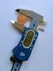 Digital calipers and a one pence piece.